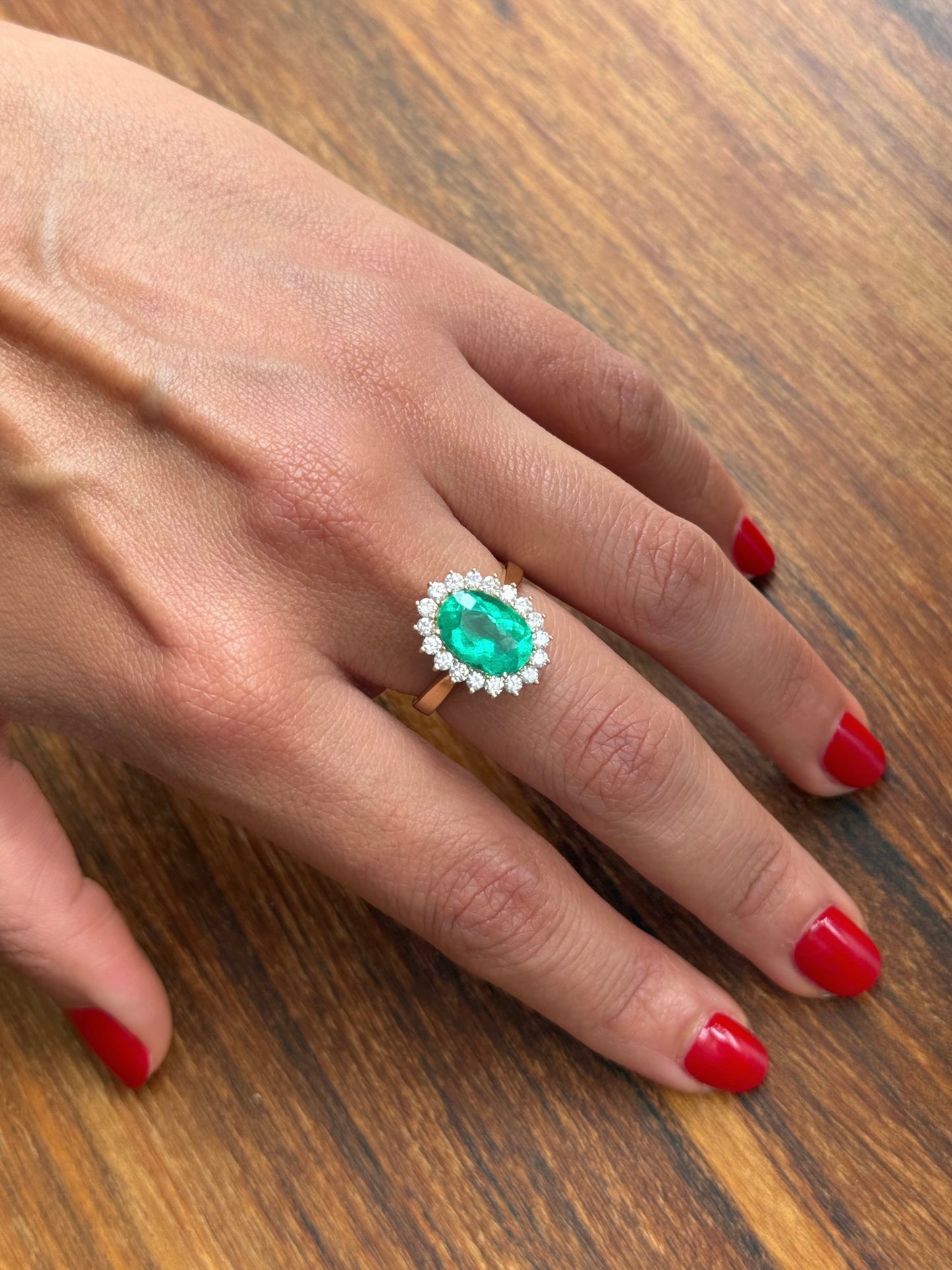 Oval emerald ring with diamonds