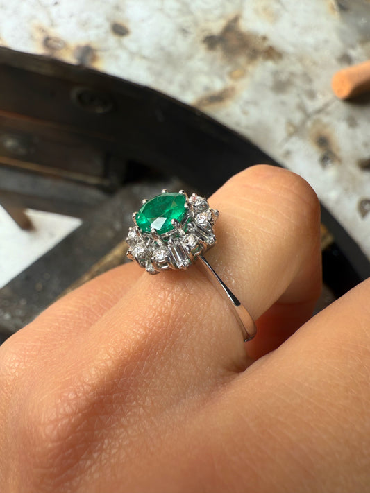 Round emerald ring with diamonds